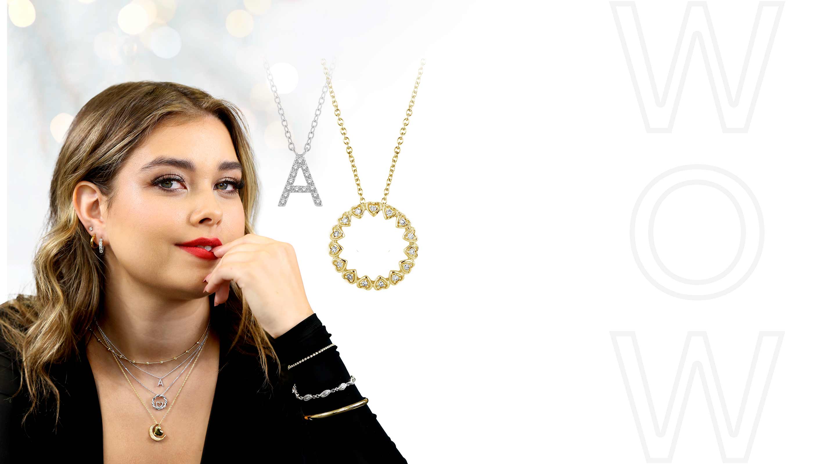 A woman wearing our top holiday gift picks including necklaces, bracelets, earrings, and more!