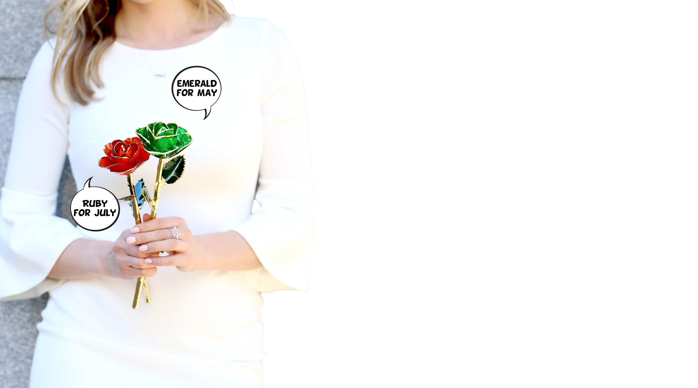 A girl in a white dress holding an Emerald Green and Ruby Red Gold Dipped Rose.