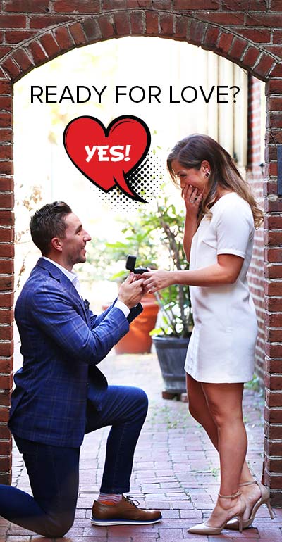 A man on one knee proposing with a ready for love, ready to ship engagement ring.